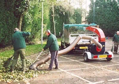 a team using Trilo SU60 for cleaning up leaves
