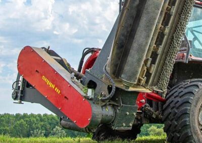 L9 flex up close from a low angle, mounted on a tractor ready to work