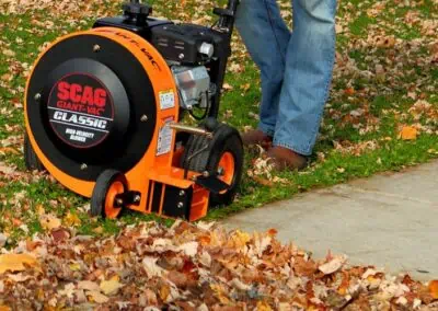 Scag Giant-Vac Classic Blower clearing leaves off pavement