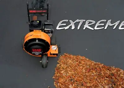 Scag Giant-Vac Extreme Blower working on pavement with leaves