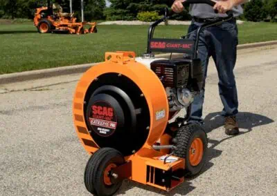 Scag Giant-Vac Extreme Pro Blower working on a property with a scag mower