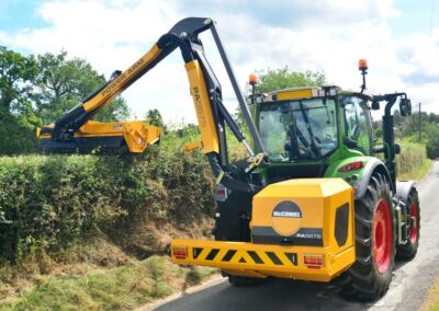 McConnel Powerarm 75 Series cutting a hedge