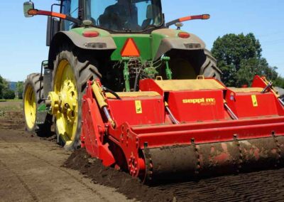 Multiforst tilling soil up close