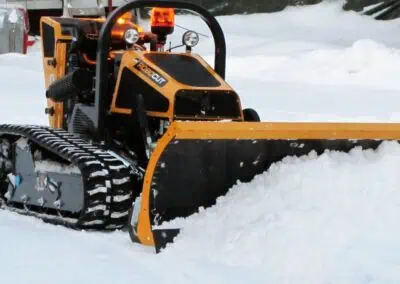 ROBO blade plowing snow up close