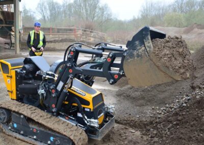 ROBOloader with bucket transporting the soil