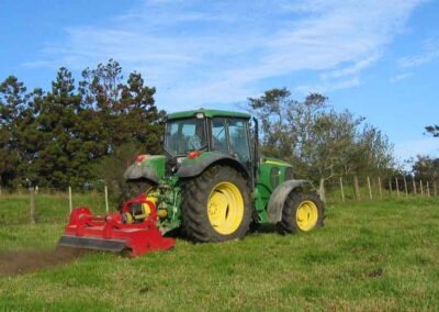 WBS clearing grass in a field