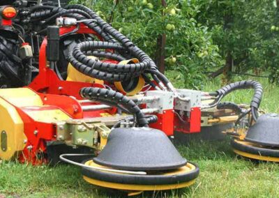 XSC finished cutting grass, attachment sitting out front